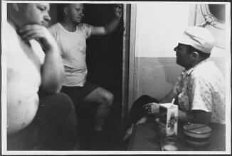 [Crew members working on the ferry.]