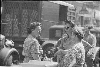 Street Conversations [Three women talking on the street.]