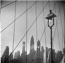 Waterfront. [Lower Manhattan skyline from Brooklyn Bridge.]