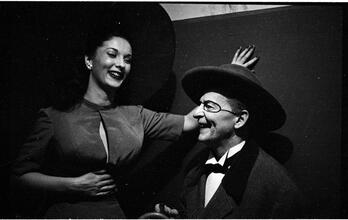 Show Girl [Rosemary talking to a man in costume.]