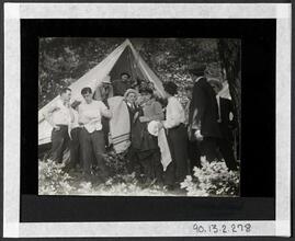 [Group of men in front of tent.]