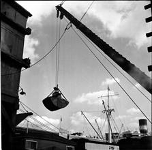 Waterfront. [Crane on a loading dock.]