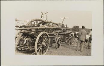 [Men with early fire engine.]