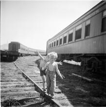 Circus [Boys playing on railroad tracks.]