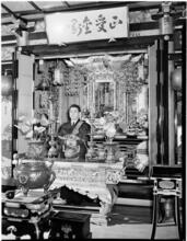 [Man at ornate altar.]