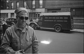 Paddy Wagon [Man with welding equipment used in the making of the television show Paddy Wagon.]