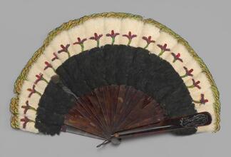 Folding feathered fan of hummingbird feathers