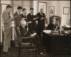[Al Smith being interviewed in his office.]