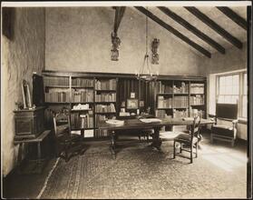 [Interior, library or study.]
