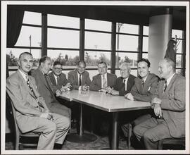 For 34 Years of Loyal Service - Eric S. Barron [Eric Barron and other men at a table.]