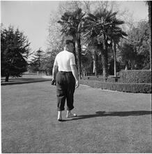 Arthur Godfrey [Godfrey walking in a golf course.]