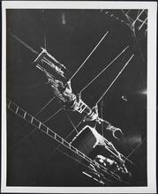[Acrobats on high wire at a circus.]