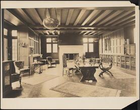 [Interior, library or study.]