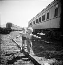 Circus [Boys playing on train tracks.]