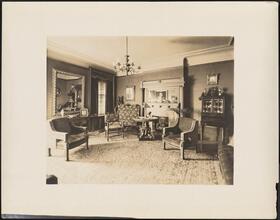 [Residence. Interior, parlor.]