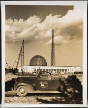 [New York World's Fair. Motor police officer in front of New York City Building. Construction view. (With the Trylon and Perisphere in the background.).]