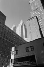 [Looking north toward the towers of the Waldorf-Astoria from 525 Lexington Avenue.]