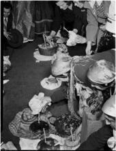 [Group with baskets of eggs.]
