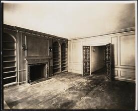 [Interior, empty parlor.]