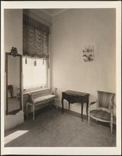 [Residence. Interior, with chair and bench.]