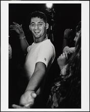 [Young man dancing at a Palestinian wedding at Widdi's Catering Hall.]