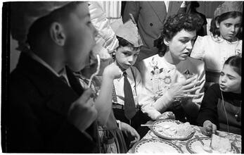 Deaf Children [Children eating cake at a party.]