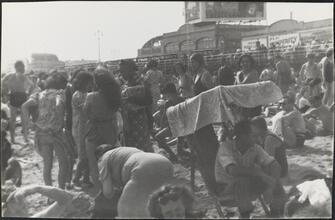 [Crowds on Coney Island beach and boardwalk.]
