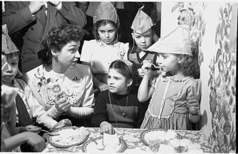 Deaf Children  [Children eating cake at a party.]