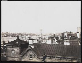 Fulton Ferry Terminal with the Brooklyn Bridge under construction in the background.]