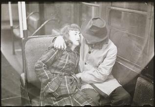 Life and Love on the New York City Subway [Couple on a subway.]