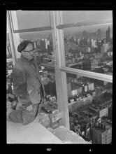750 3rd Avenue Between 46th and 47th Street. [Construction view], Measuring and Lining Up Frames (Note Bolt at [Bottom?] of Frame)