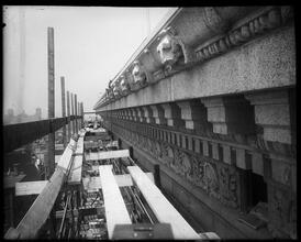 University Club. Stone cornice under construction.