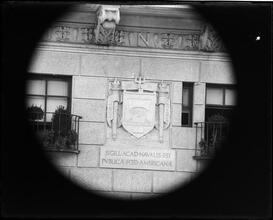 University Club seal on building wall.