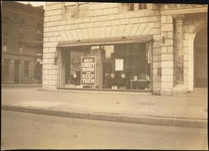 Street Scenes, etc. Showing Displays of Liberty Loan Posters during World War I [Liberty Loan poster in a store window.]