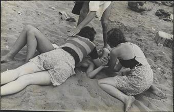 [Teenagers playing on beach at Coney Island.]
