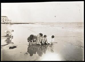 [Playing by the water.]