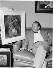 Art by Celebrities Sponsored by the Urban League [Arthur Freed with his painting.]