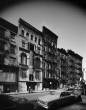 [Cylindrical fire escape on the façade of 62 East 4th Street.]