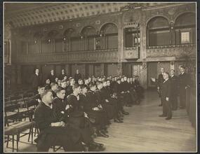 Officers and men from the U.S.S. "Maryland" listening to a talk by Chef Leoni in Ballroom of Hotel Commodore.