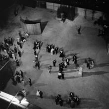 [Elevated view of MoMA sculpture garden at night.]