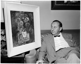 Art by Celebrities Sponsored by the Urban League [Arthur Freed with his painting.]