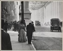 [Street scene with photographer and festoons, Dewey Parade]