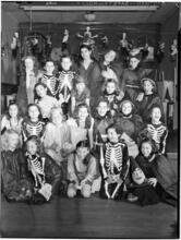 [Children in Halloween costumes.]