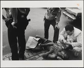 New York City, 9th Police Precinct, Man Reported Sick on City Street, Waiting for Hospital Wagon, 1978
