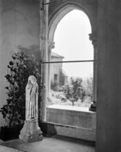 [Sculpture by a window at the Cloisters.]