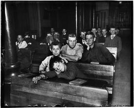 Night school in the west side lodging house. Edward, the little pedlar, caught napping.
