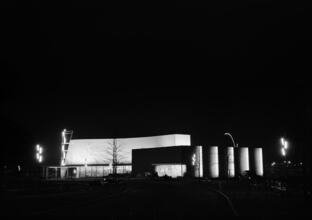[Night view of the Production and Distribution building, New York World's Fair.]