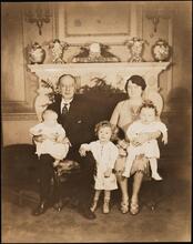 [Al Smith and his wife with their grandchildren.]