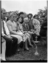 [Woman smoking a hookah.]