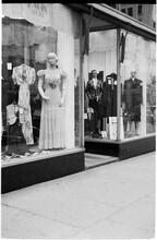 [Window displays of clothing store.]
